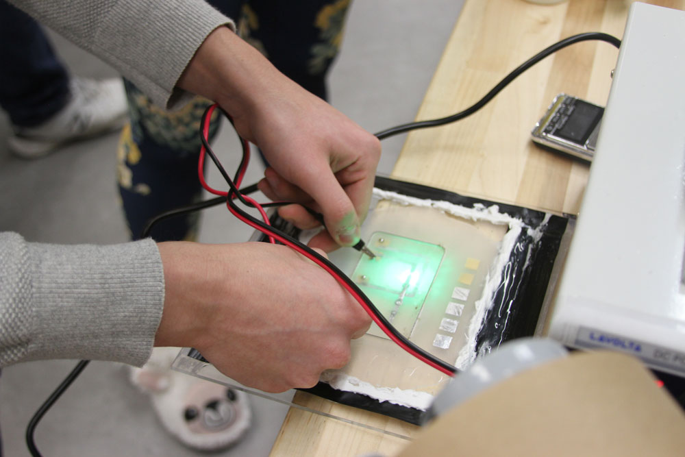 hands on a switch board.