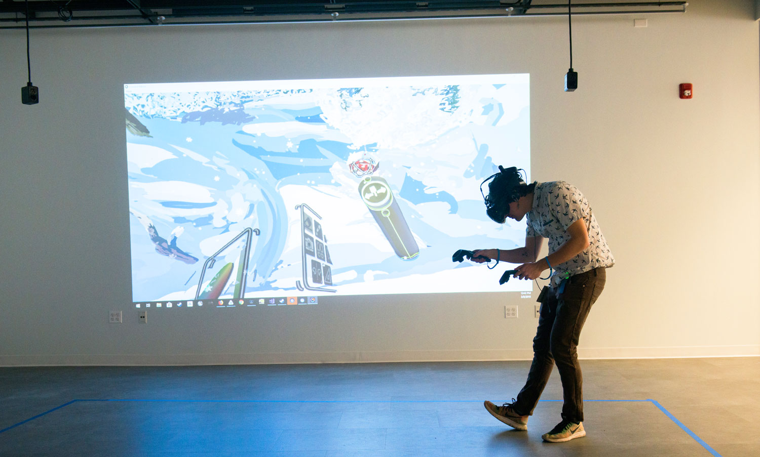 A student using VR equipment in the MADD Center.