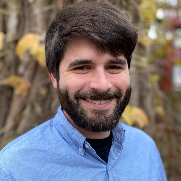 headshot of Cameron Mankin against natural background. 